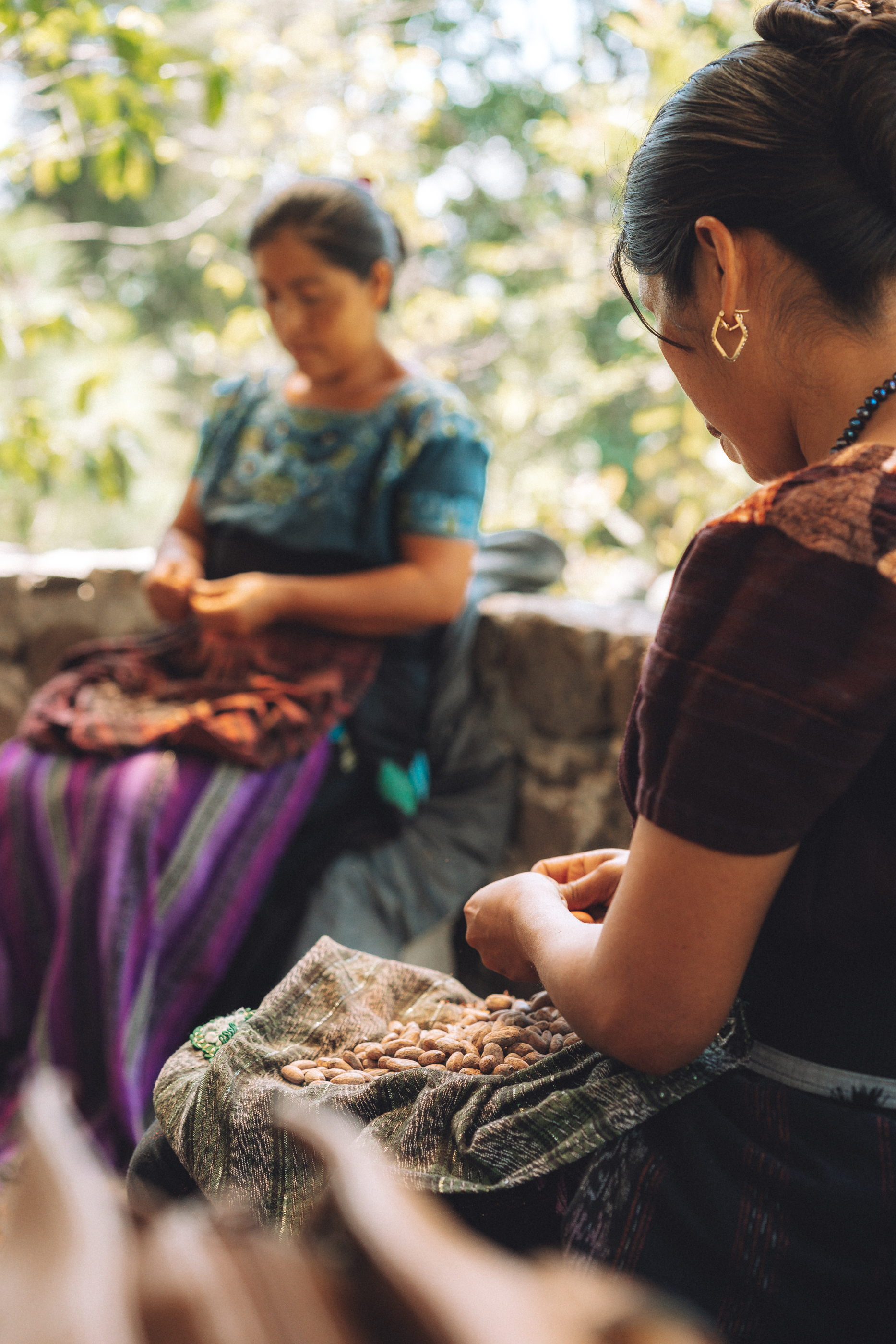 Mayan women processing cacao